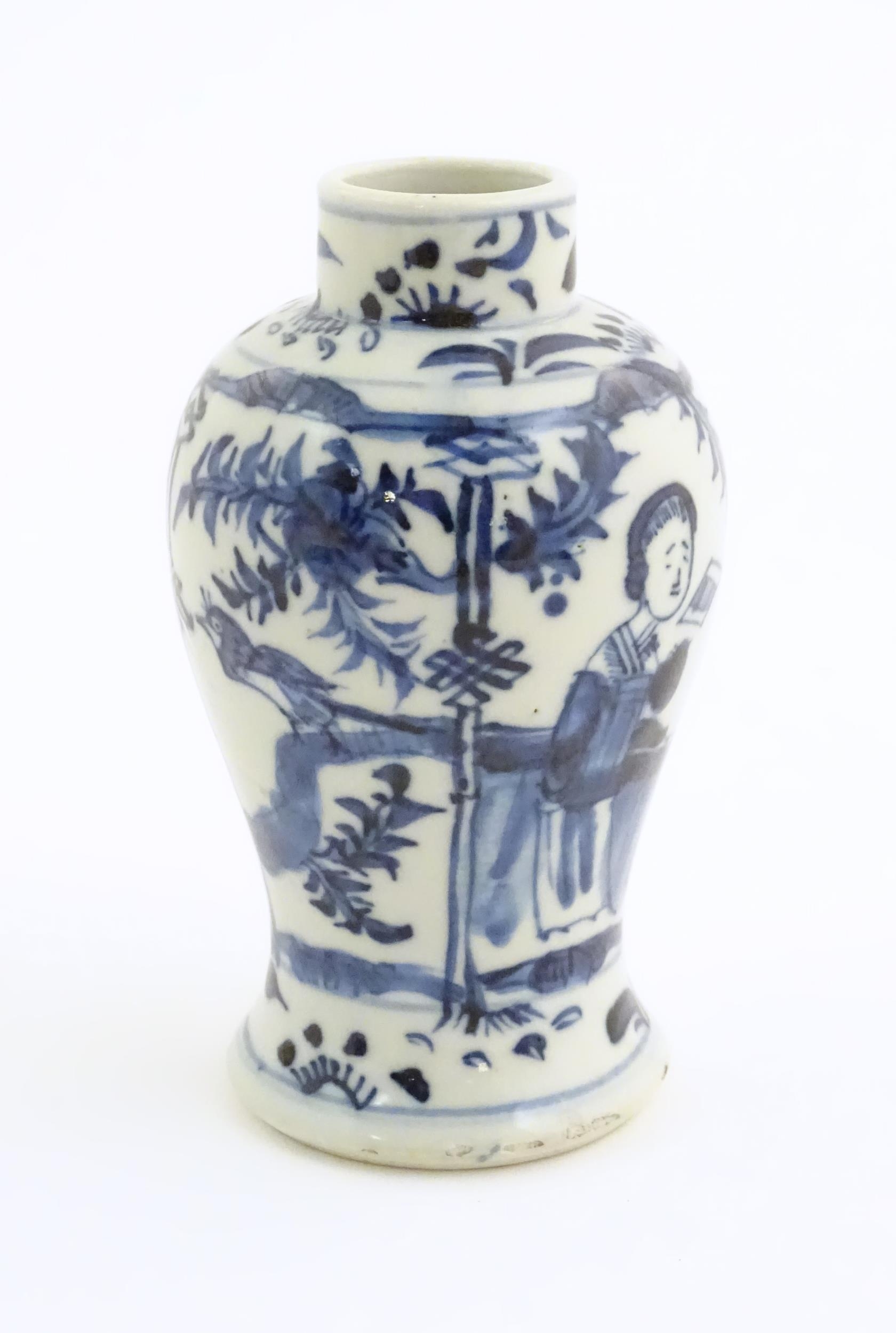 A small Chinese blue and white vase decorated with figures on a garden terrace with flowers and - Image 4 of 7