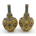 A pair Zsolnay bottle vases with reticulated decoration. Indistinctly marked under. Approx. 8 1/4"