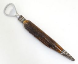 A Victorian antler handled bottler opener with silver collar and mount, hallmarked Sheffield 1888,