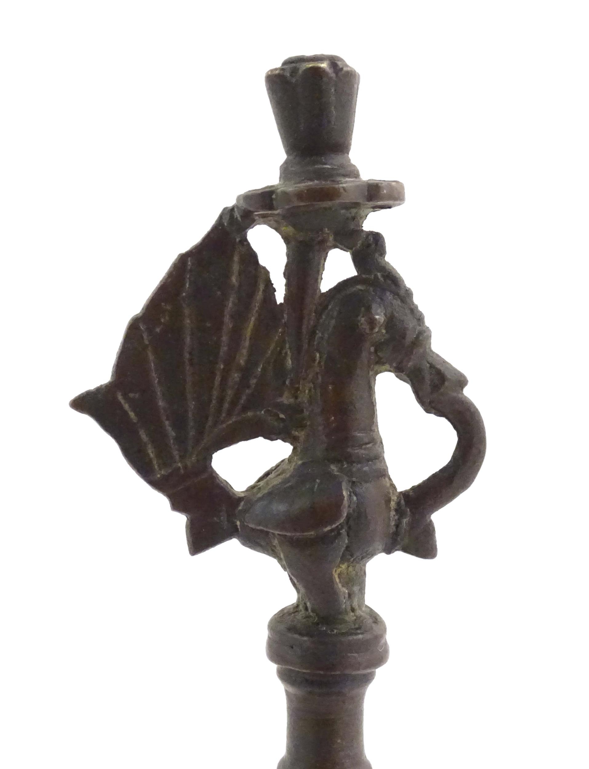 An Indian / Deccan cast temple style oil lamp with turned column surmounted by a Hamsa bird. Approx. - Image 8 of 8