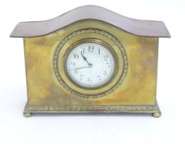 A mantle clock by Japy freres the shaped brass case with enamel dial marked signed Japy freres mark.
