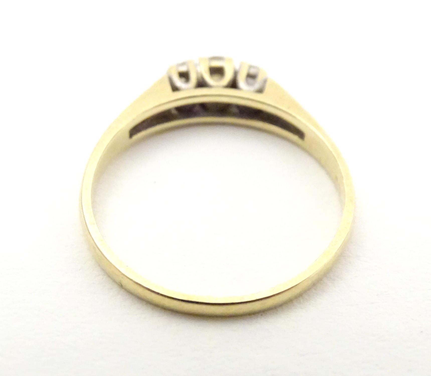 A 9ct gold ring set with trio of diamonds. Ring size approx N. Please Note - we do not make - Image 2 of 6