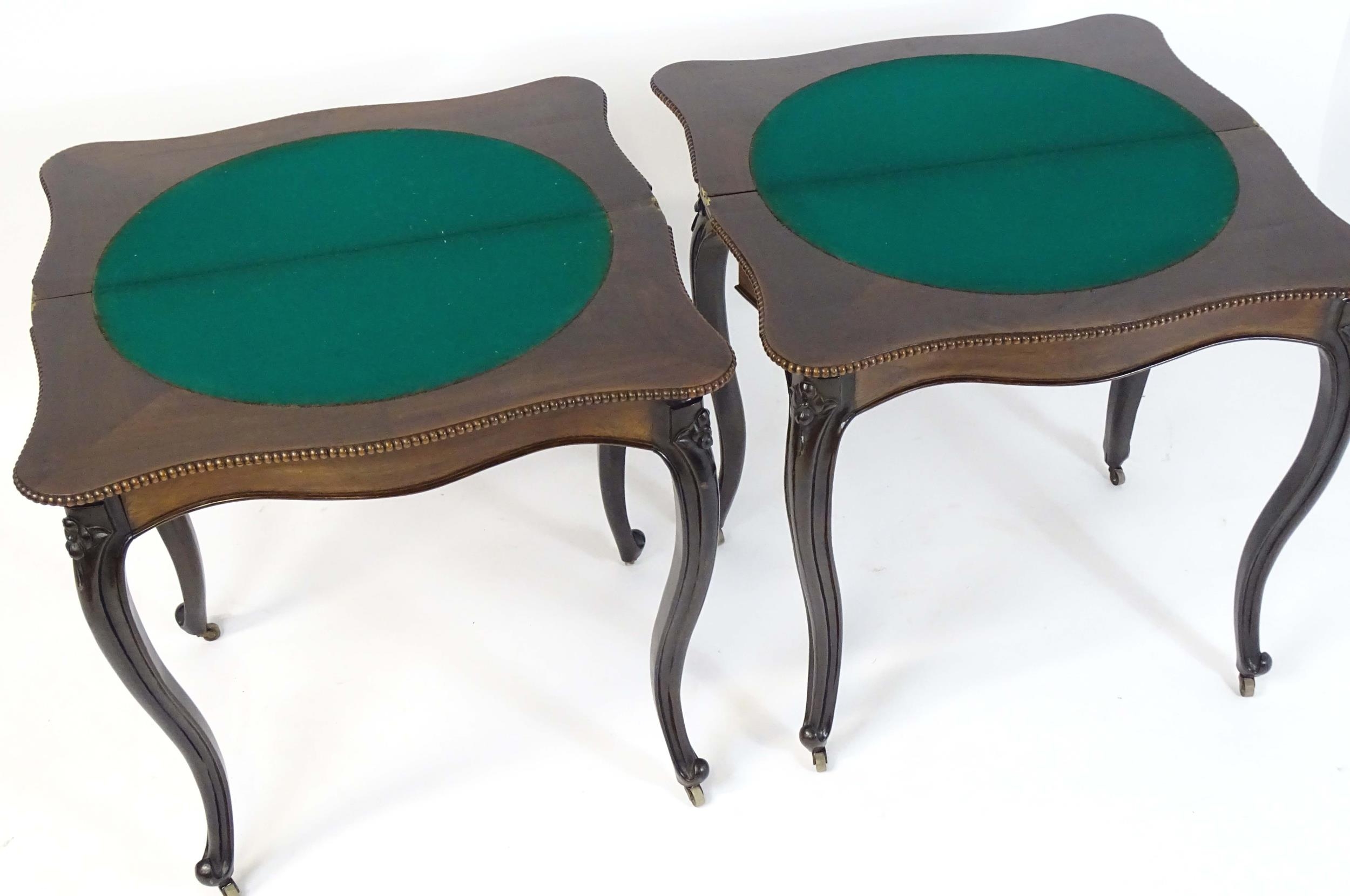 A pair of 19thC rosewood card tables of serpentine form, having beaded edges above floral carved - Image 15 of 18