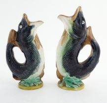 Two Victorian majolica gurgle jugs modelled as fish. Marked under 116. Largest approx. 9 3/4"