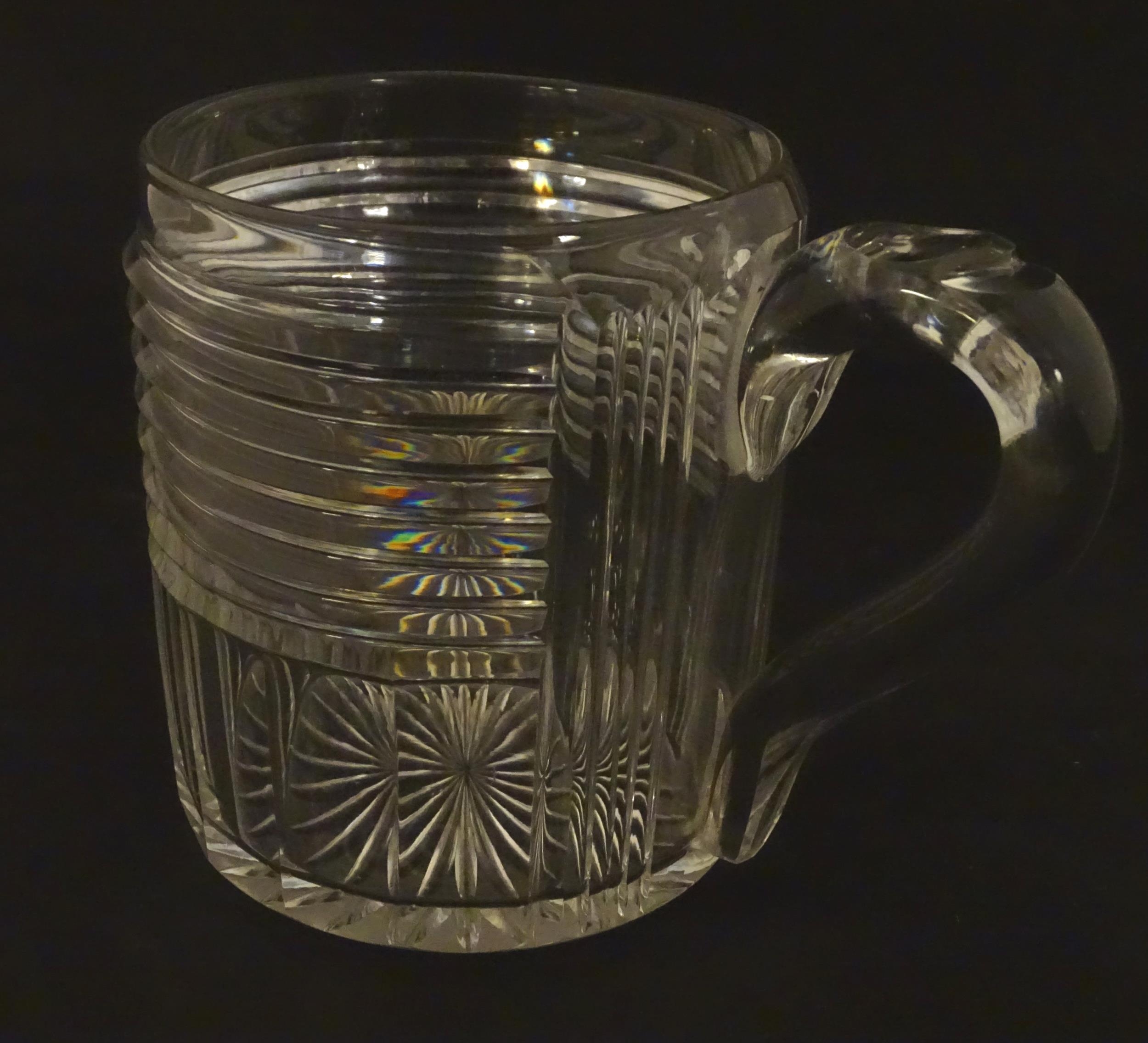 An early 19thC cut glass tankard 4 1/2" high Please Note - we do not make reference to the condition