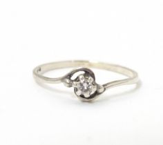 A diamond solitaire ring in a platinum setting. Ring size approx. O Please Note - we do not make