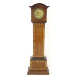 A mantle clock formed as a miniature long case / grandfather clock. Approx. 16 1/2" high Please Note