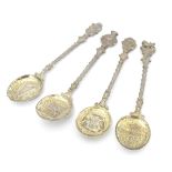 A set of four commemorative coronation Edward VII silver gilt spoons the handles and decorated