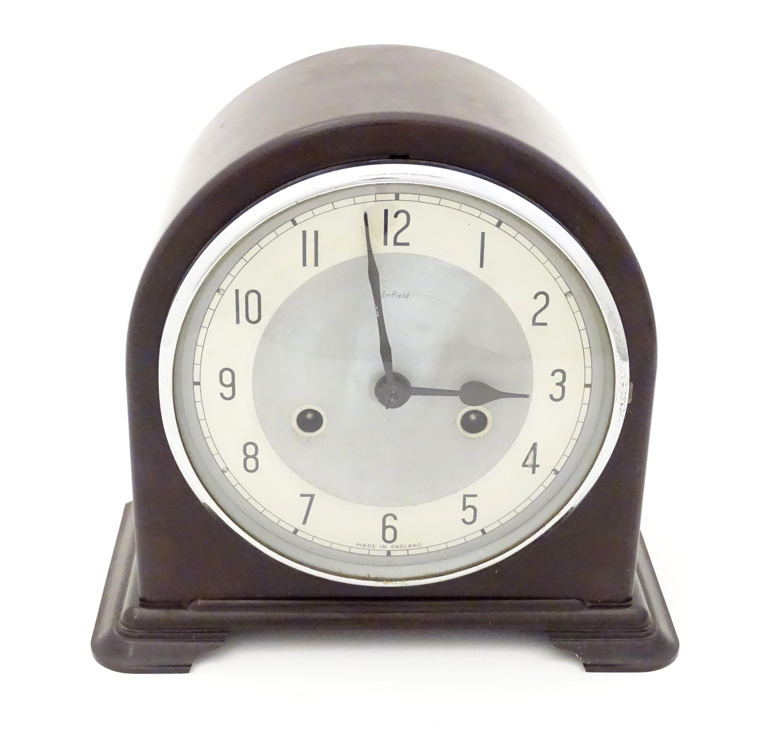 An Art Deco Smiths Enfield Bakelite cased mantel clock 8" high Please Note - we do not make