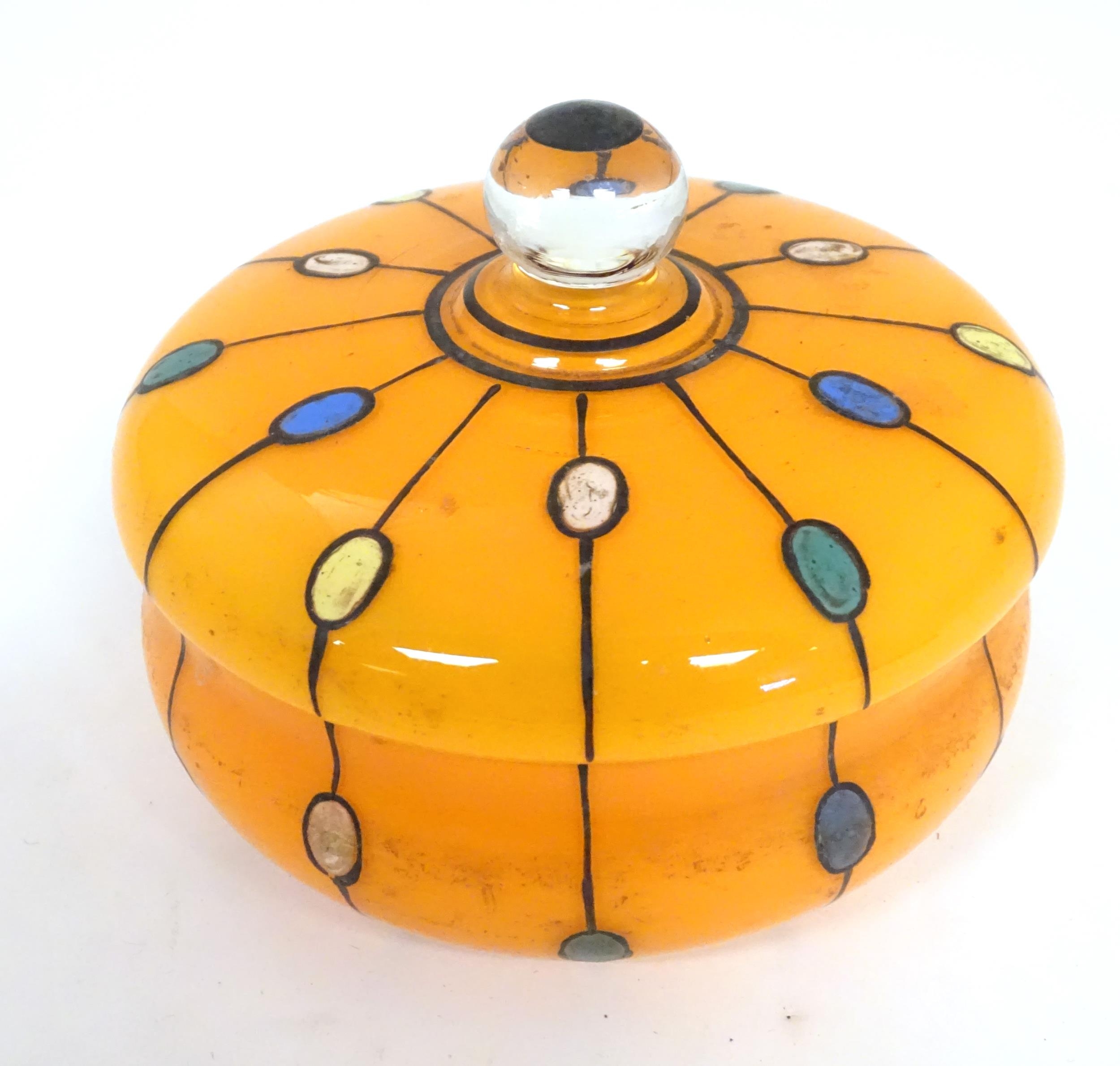 A Continental retro glass powder bowl with orange body and cover and painted detail, inspired by the