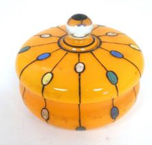 A Continental retro glass powder bowl with orange body and cover and painted detail, inspired by the