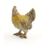 A cold painted bronze model of a chicken. Approx. 1" high Please Note - we do not make reference