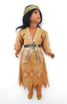 Toy: A 20thC Continental doll modelled as a Red Indian woman, possibly Pocahontas. With a bisque