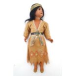 Toy: A 20thC Continental doll modelled as a Red Indian woman, possibly Pocahontas. With a bisque