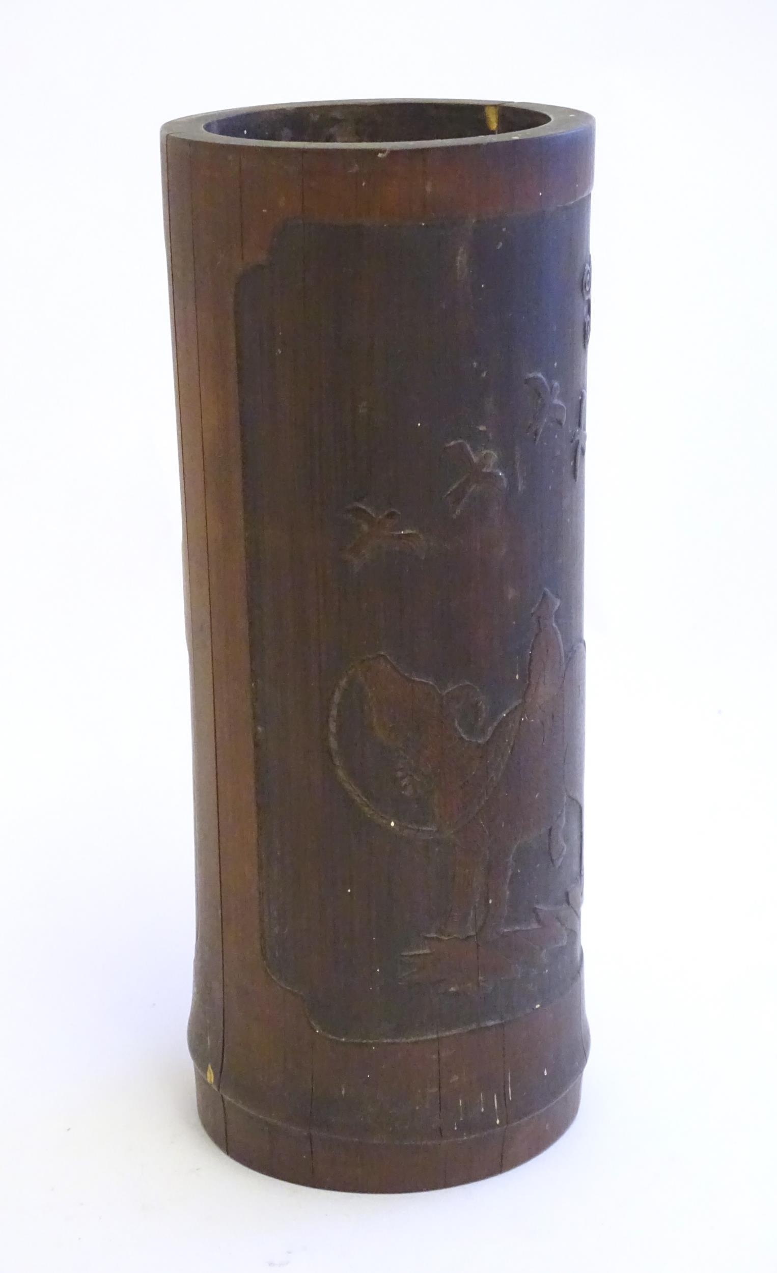 An Oriental carved bamboo vase depicting a figure on a water buffalo with birds. Approx. 10" high - Image 4 of 6