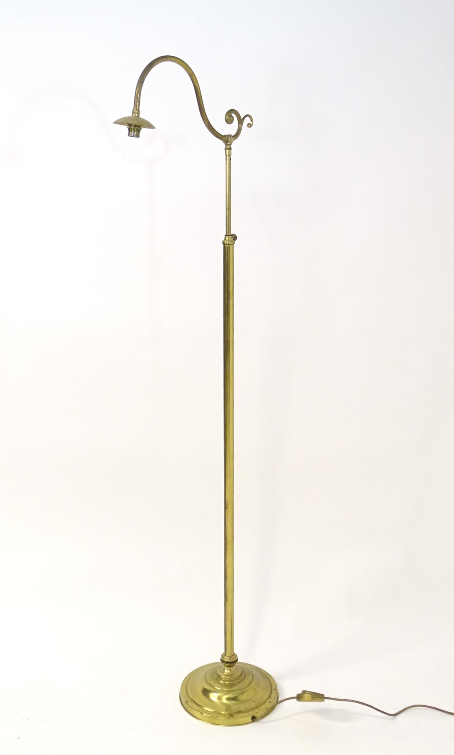 A 20thC brass standard lamp of adjustable height. Approx 75" high (fully extended) Please Note -