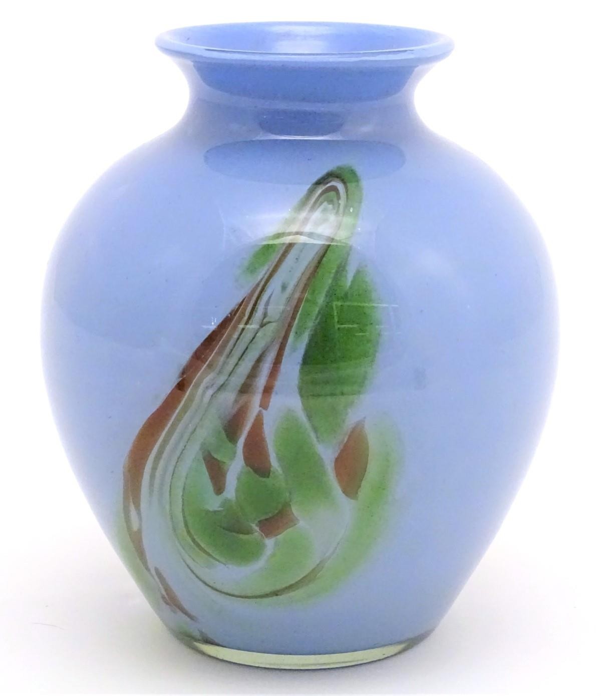 A large mid-20thC Murano studio glass vase, of blue opaque finish embellished with swirling