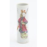 A Chinese brush pot of cylindrical form decorated with a figure and Character script. Character