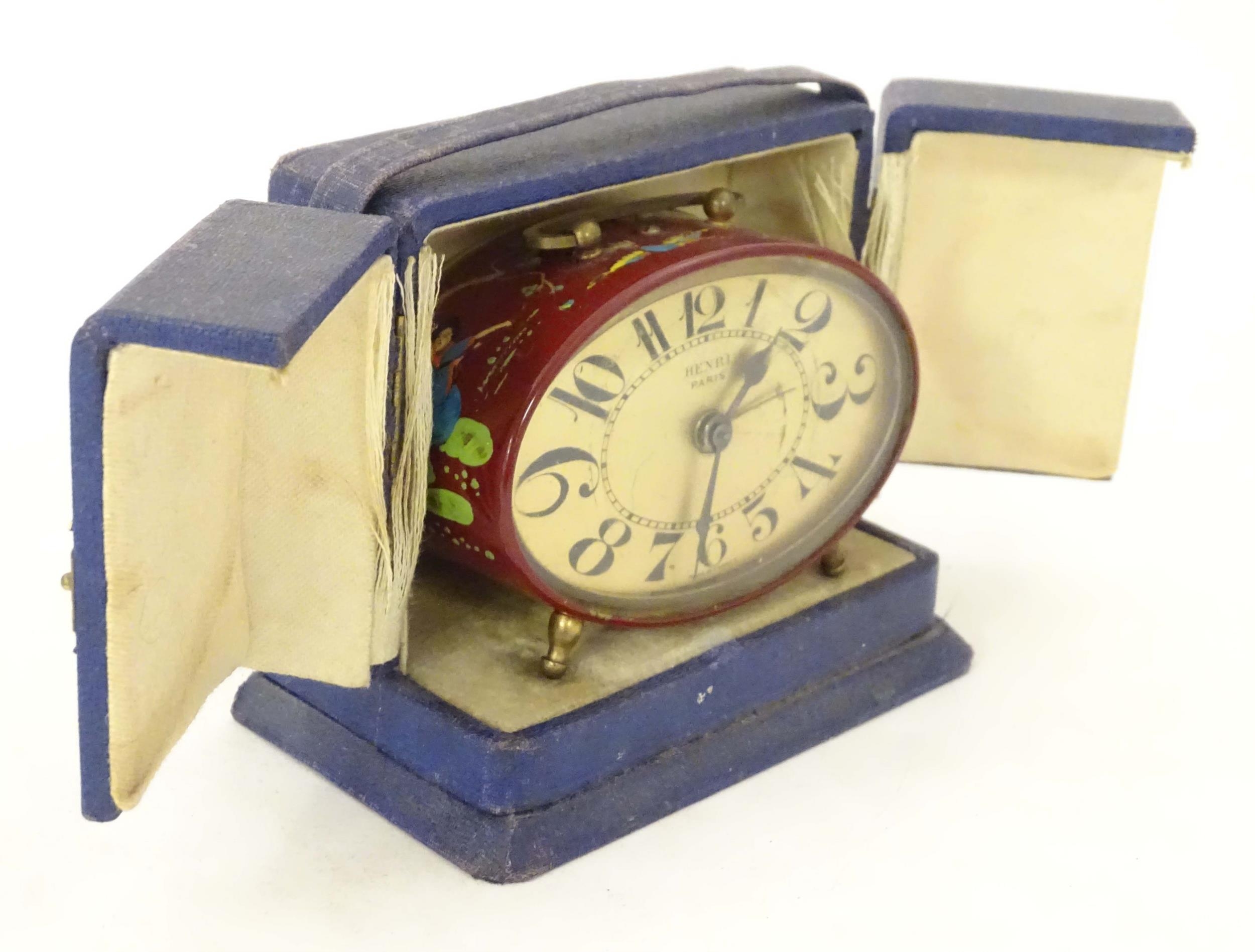 A 20thC French red lacquered travelling alarm clock with chinoiserie decoration. The dial signed - Image 2 of 12