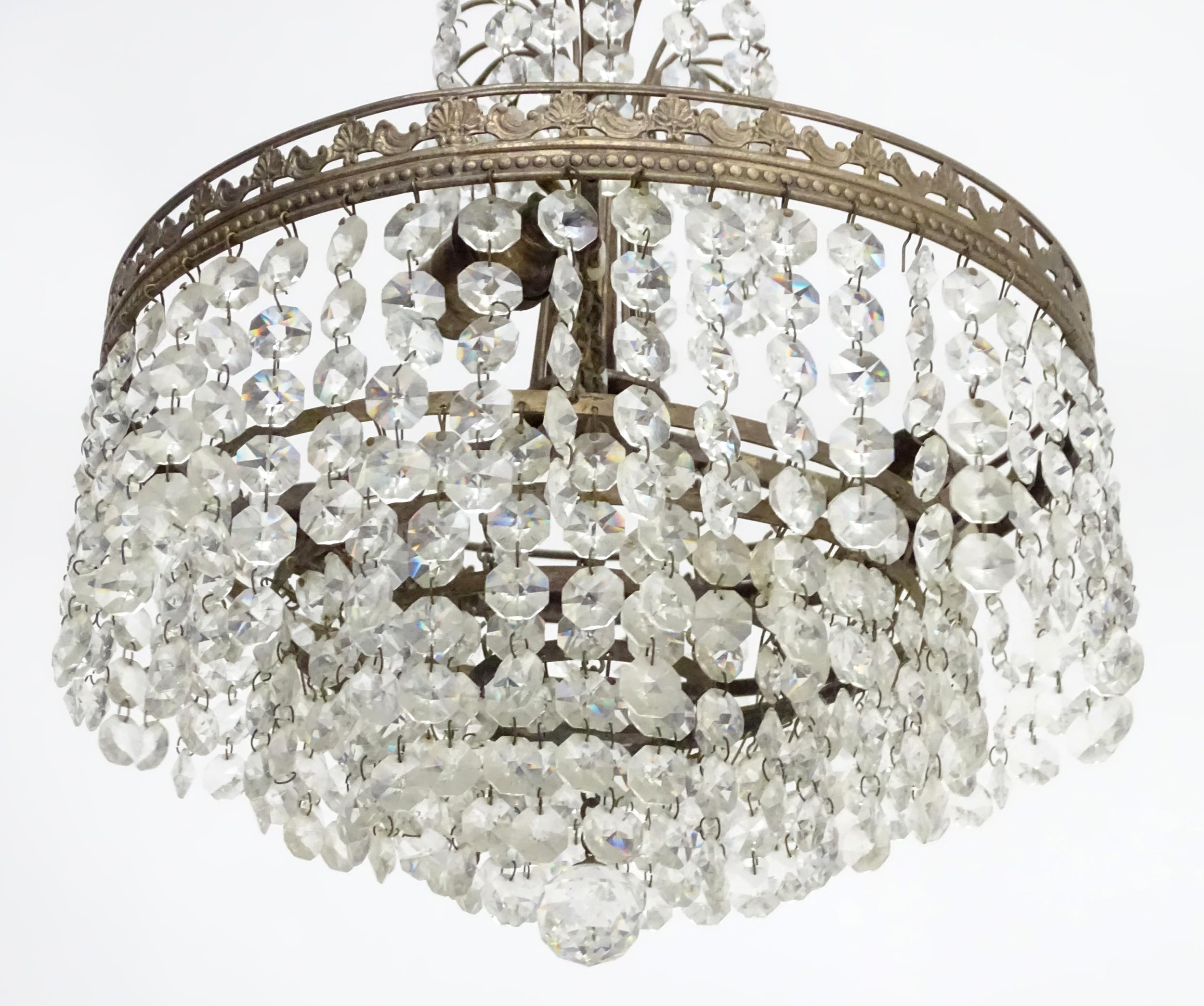 An early 20thC crystal drop bag pendant ceiling light, the chain supporting brass mounts with a - Image 7 of 8