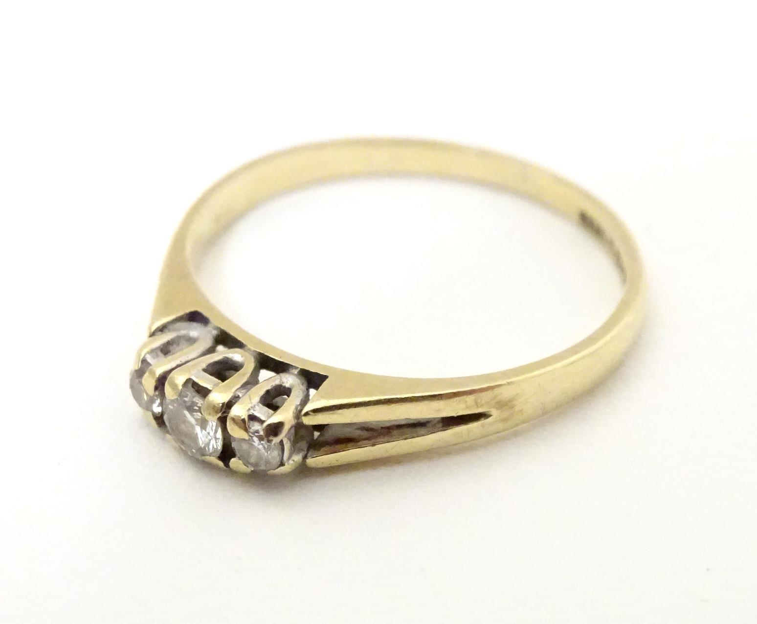 A 9ct gold ring set with trio of diamonds. Ring size approx N. Please Note - we do not make - Image 4 of 6