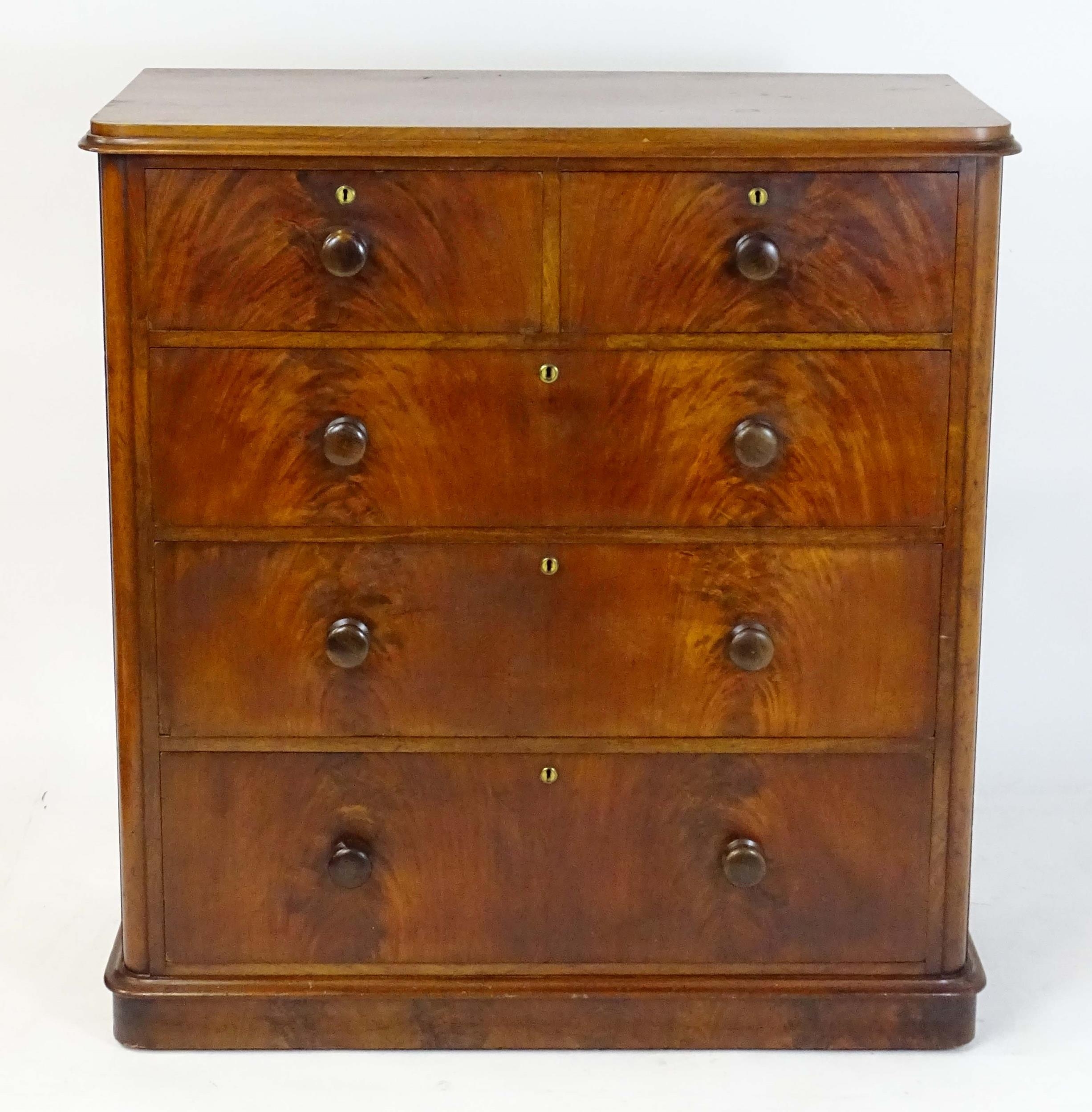 A large Victorian mahogany chest of drawers with a moulded top above two short over three long - Image 7 of 13