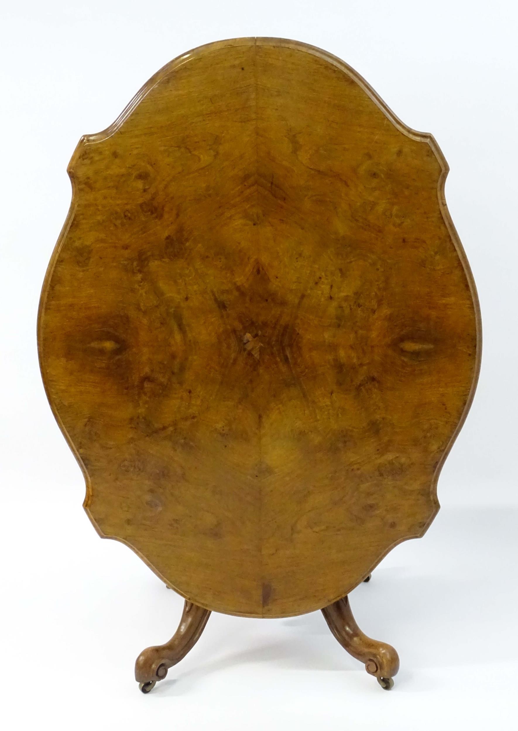 A mid 19thC walnut loo table with a burr walnut veneered top above a turned pedestal base and four - Image 9 of 12