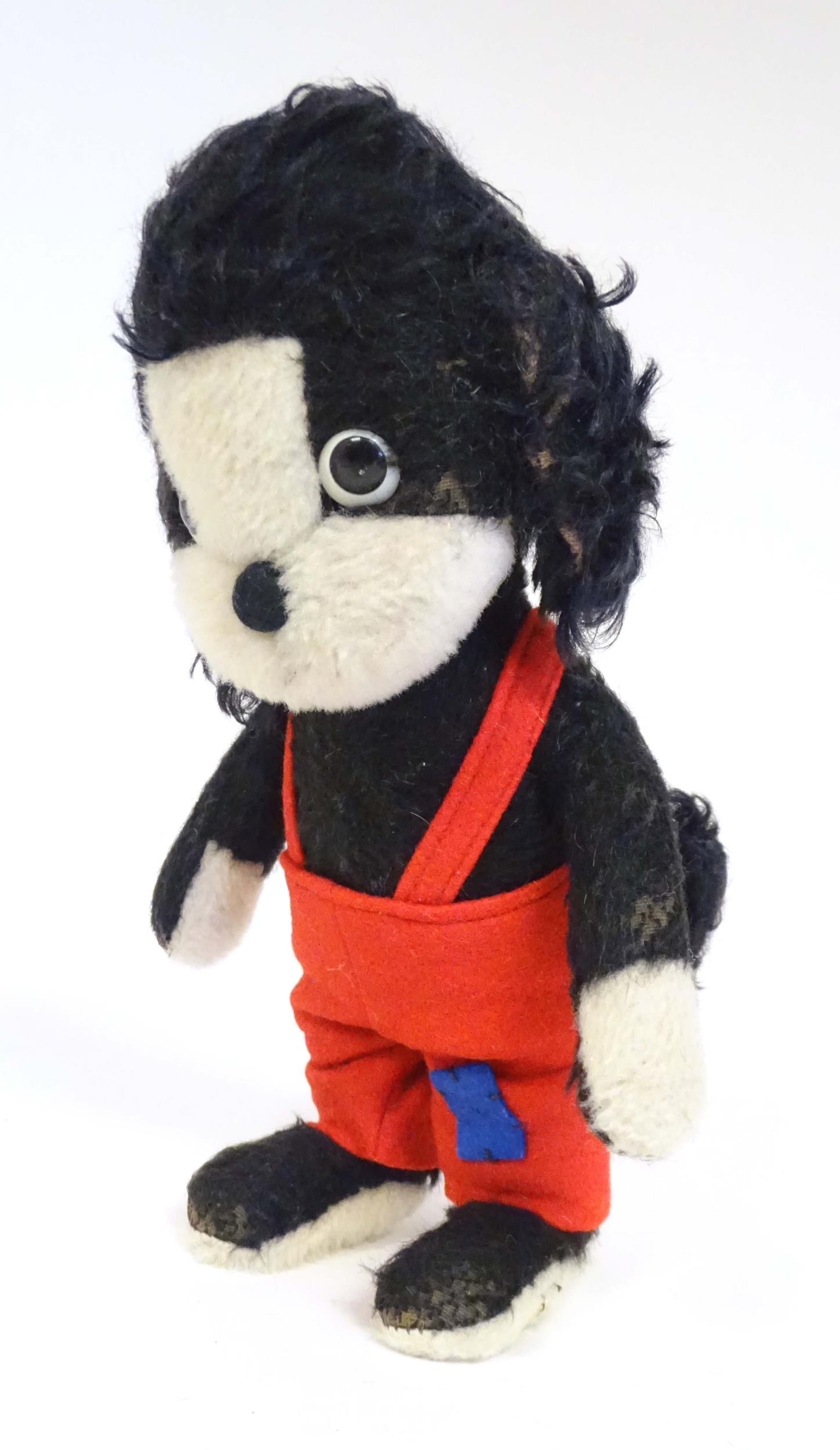 Toy: A mid 20thC Merrythought Mr Twisty stuffed toy dog, bearing label under. Approx. 11" high - Image 3 of 7