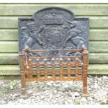 A cast iron fireback, decorated with the Royal Coat of Arms of the United Kingdom, measuring 24"