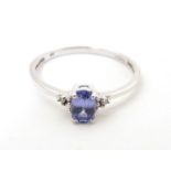 A 9ct white gold ring set with tanzanite. Ring size approx. N 1/2 Please Note - we do not make