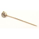 A 9ct gold stick pin with seed pearl. Approx 2 1/4" long Please Note - we do not make reference to