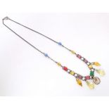A white metal necklace with various coloured facet cup beads and drops, etc. Approx. 16" long Please