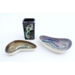 Two studio pottery shaped dishes by Jo Lester, one with seahorse decoration, the other with dragon