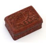 A Chinese cinnabar lacquer lidded box, the lid with carved detail depicting a landscape scene with