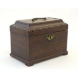 An 18thC mahogany tea caddy with handle to lid. Approx. 6 1/2" high Please Note - we do not make