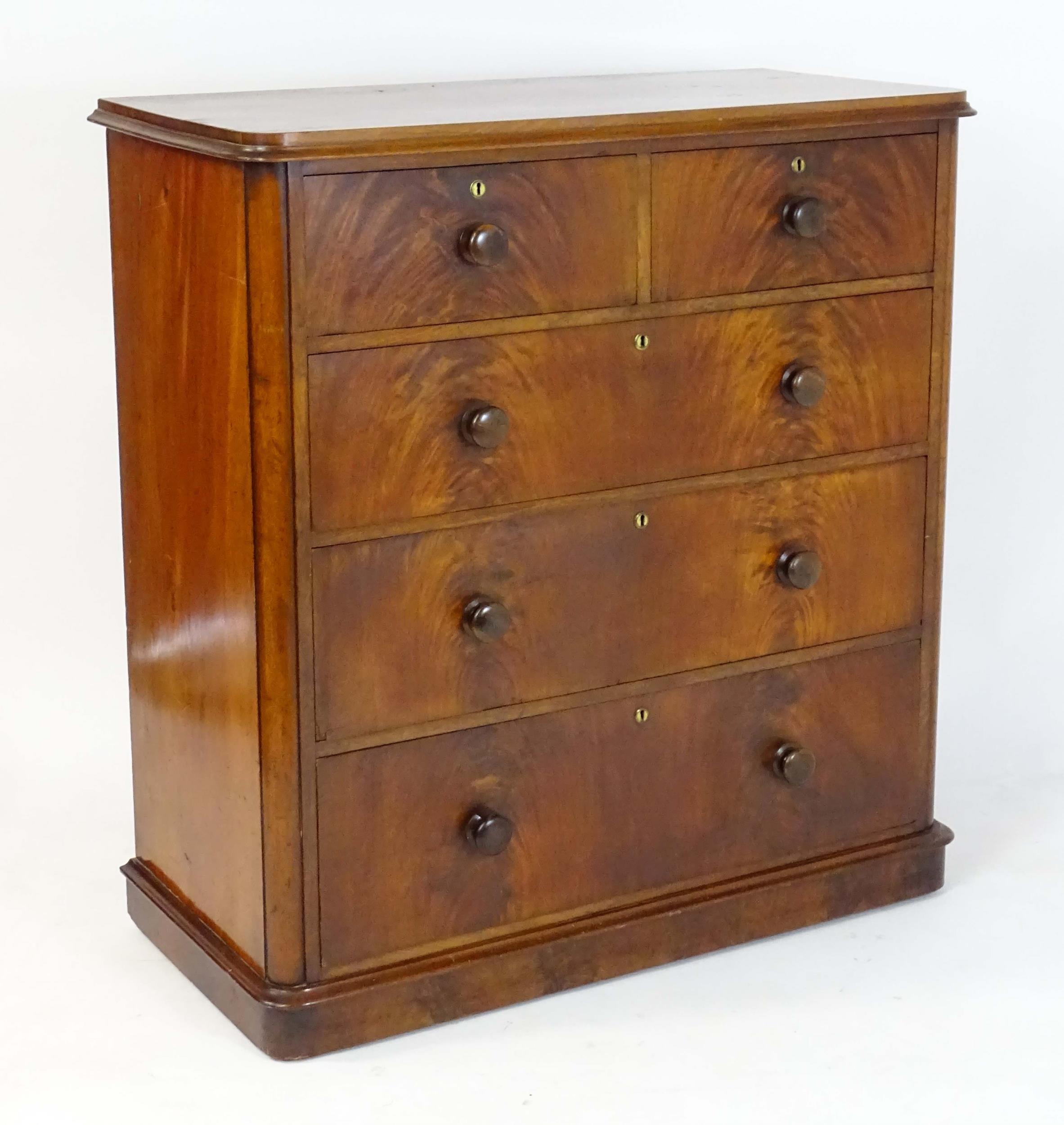 A large Victorian mahogany chest of drawers with a moulded top above two short over three long - Image 3 of 13