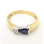 An 18ct gold ring set with sapphire and diamond. Ring size approx. L Please Note - we do not make