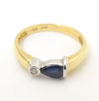 An 18ct gold ring set with sapphire and diamond. Ring size approx. L Please Note - we do not make