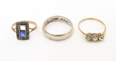 Three various rings comprising a silver band, a 9ct gold ring and a 9ct gold and silver ring (3)