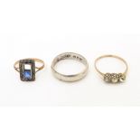 Three various rings comprising a silver band, a 9ct gold ring and a 9ct gold and silver ring (3)