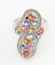 A 18ct white gold dress ring set with various coloured stones. Ring size approx. N 1/2 Please Note -