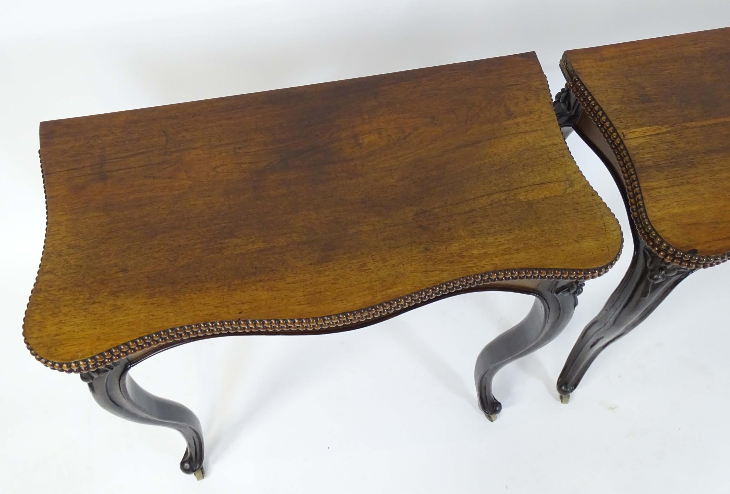 A pair of 19thC rosewood card tables of serpentine form, having beaded edges above floral carved - Image 10 of 18