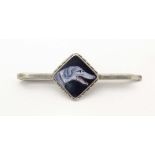 A white metal tie clip with enamel dog head detail to centre. 1 3/4" wide Please Note - we do not