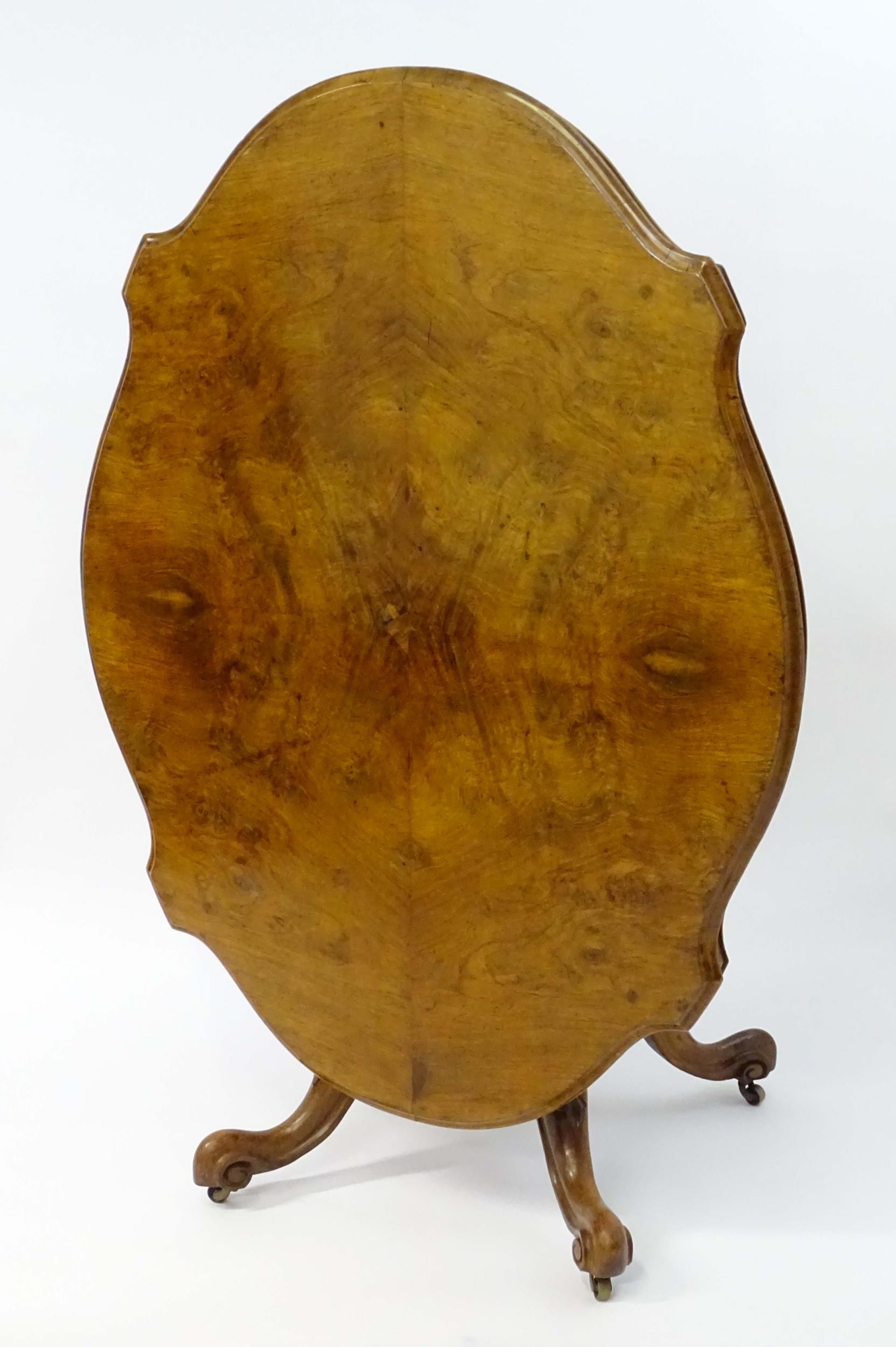 A mid 19thC walnut loo table with a burr walnut veneered top above a turned pedestal base and four - Image 8 of 12