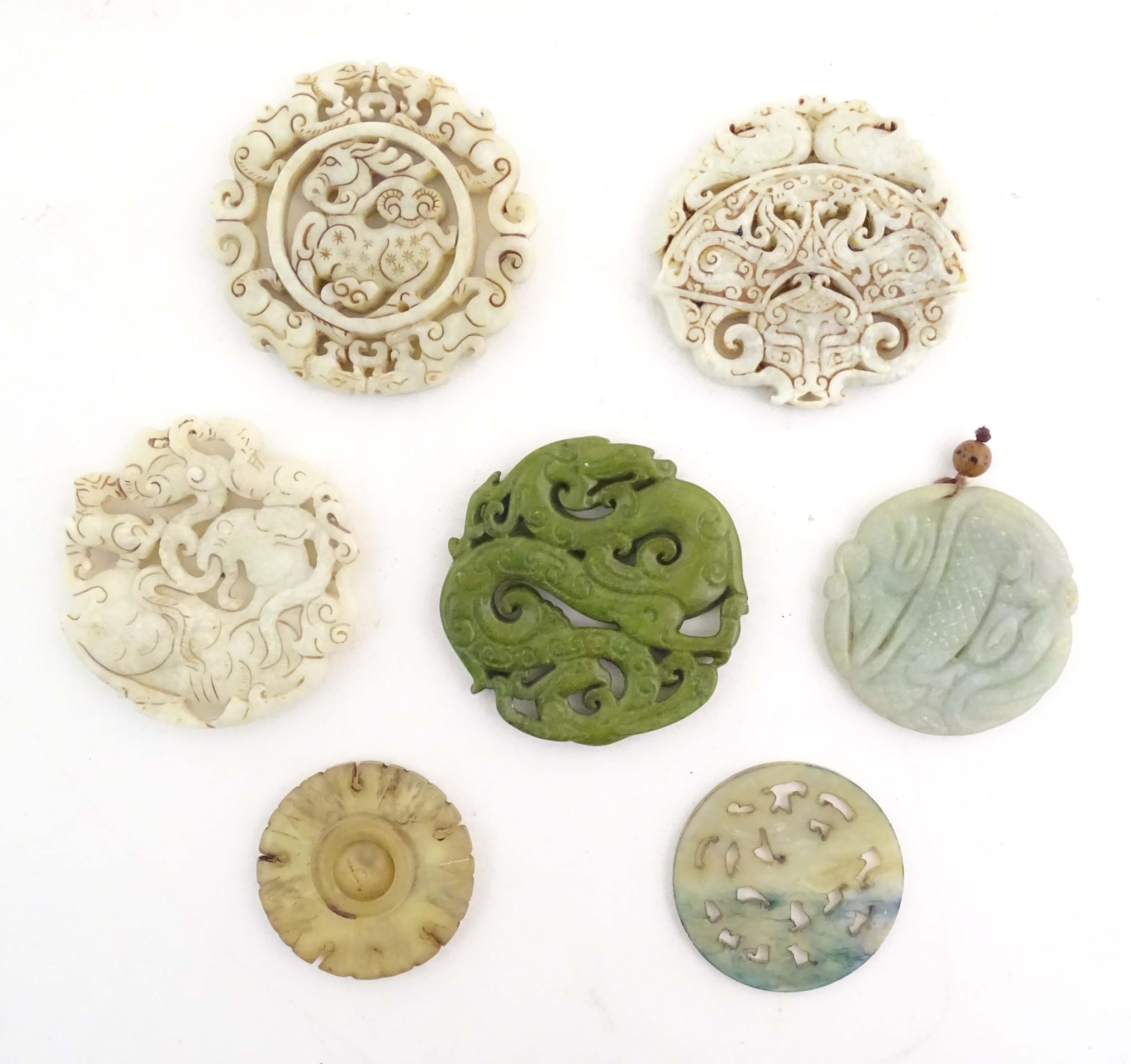 Seven assorted carved Oriental roundels / pendants, detail to include dragons, birds, stylised rams, - Image 2 of 4