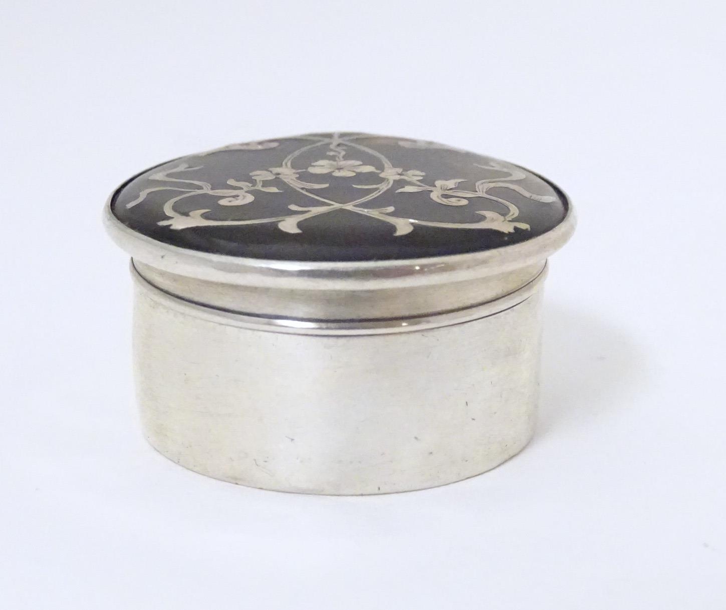 A silver and tortoiseshell pill box with pique decoration to lid. Hallmarked London 1912 Approx. 1 - Image 2 of 6