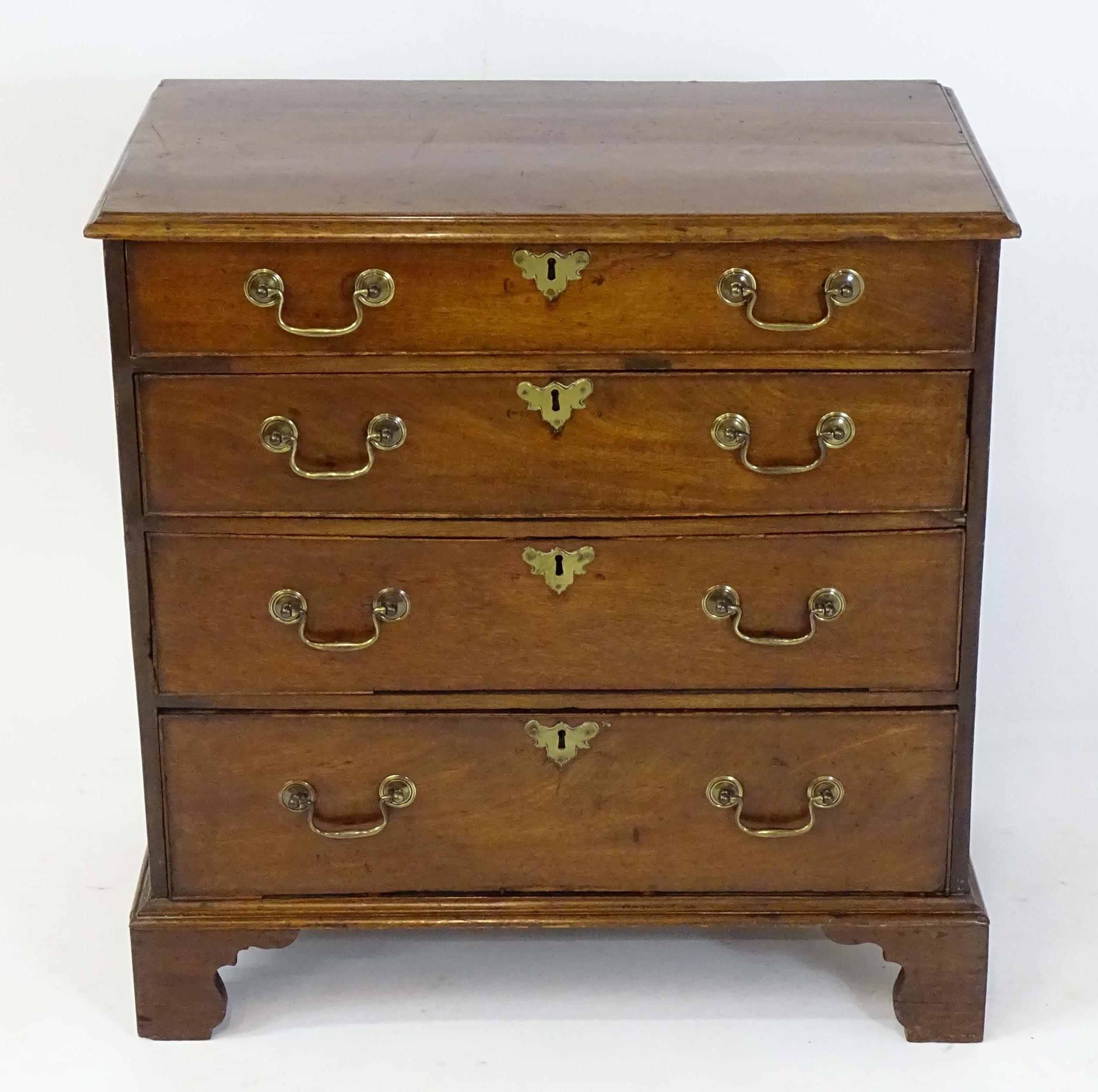 A Georgian mahogany chest of drawers with a moulded top above four long drawers with swan neck - Image 4 of 6