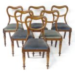 A set of six mahogany balloon back dining chairs with drop in seats above turned tapering front legs
