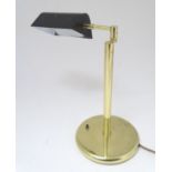 A mid to late 20thC Art Deco style brass table lamp, with articulated and adjustable shade and