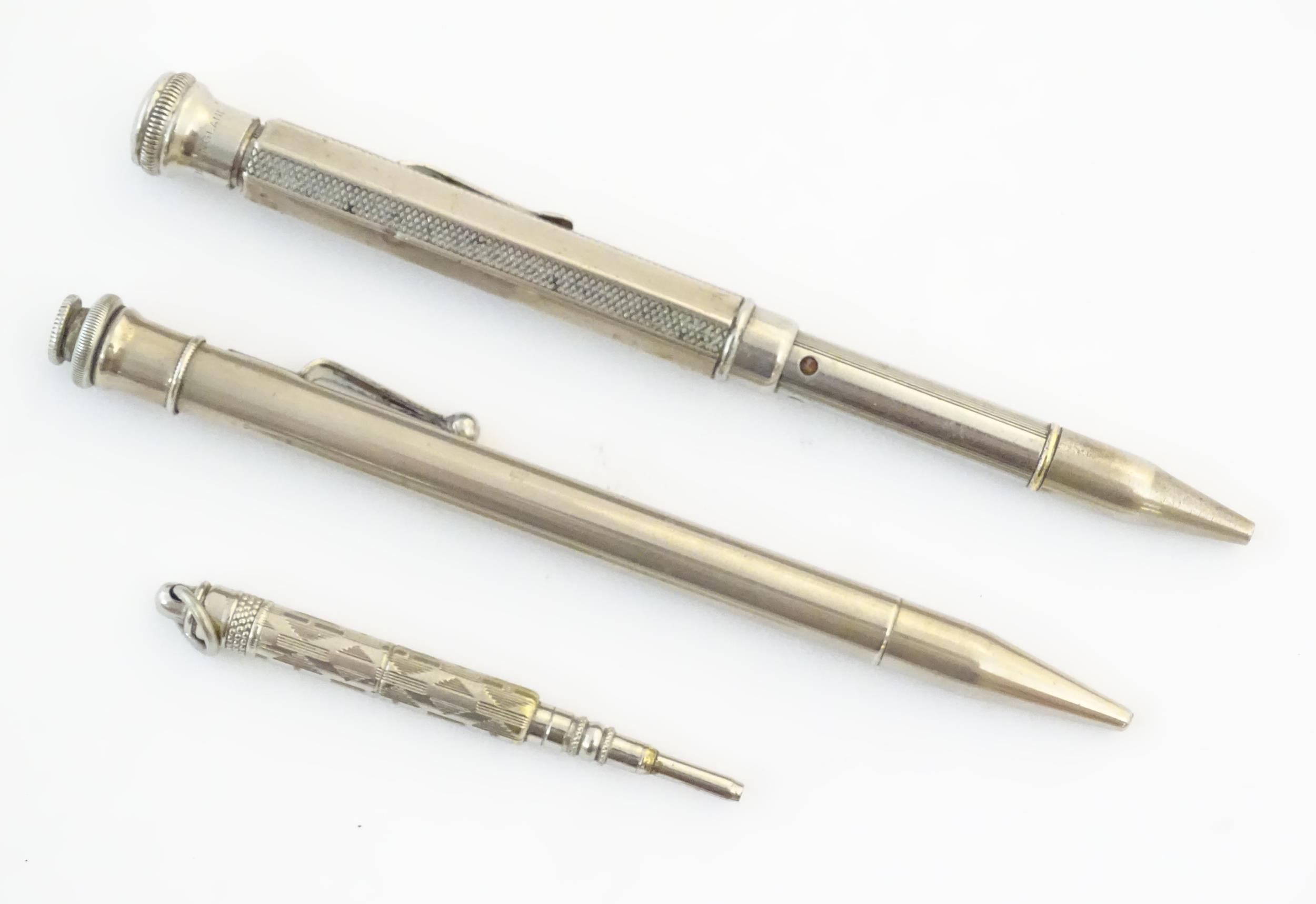 Two silver plate propelling pencils with provision for coloured leads, the other titled The Aladdin. - Image 2 of 9